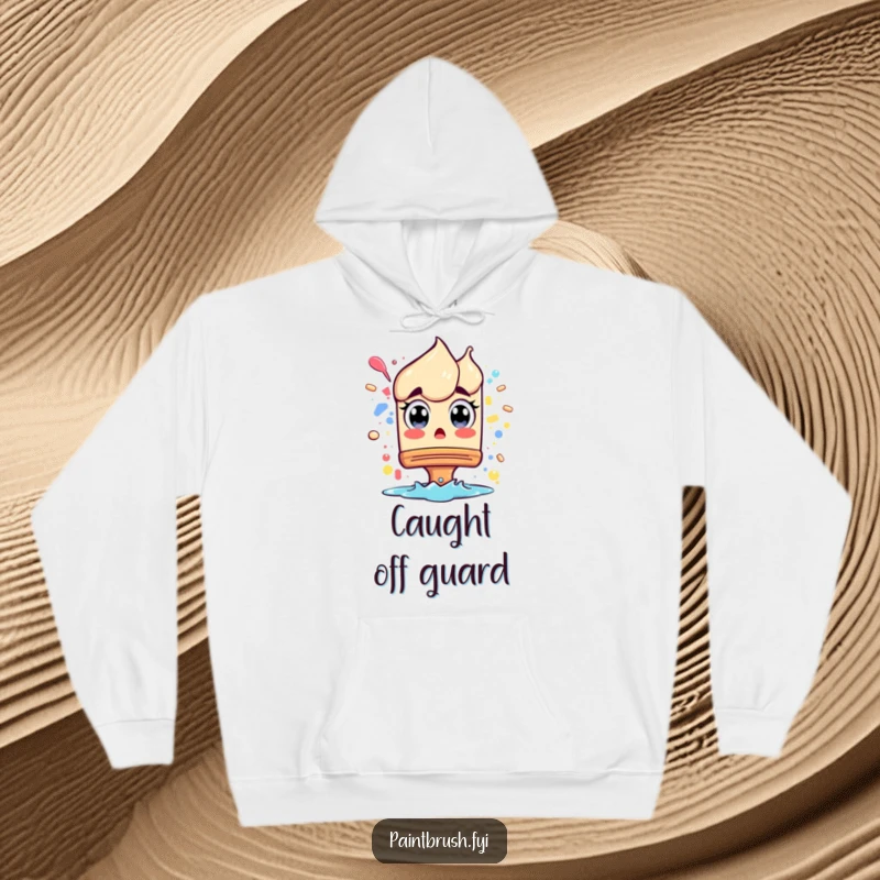 Funny Hoodie: A surprised paintbrush character with wide eyes from a splash, offering cozy comfort and a relatable artistic moment.