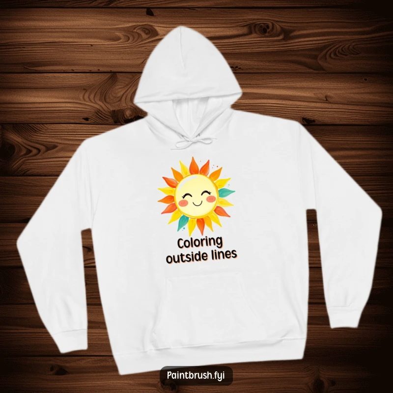 Funny hoodie depicting a paintbrush character vividly painting a smiling sun, radiating warmth and vibrant colors, symbolizing artistic creation.