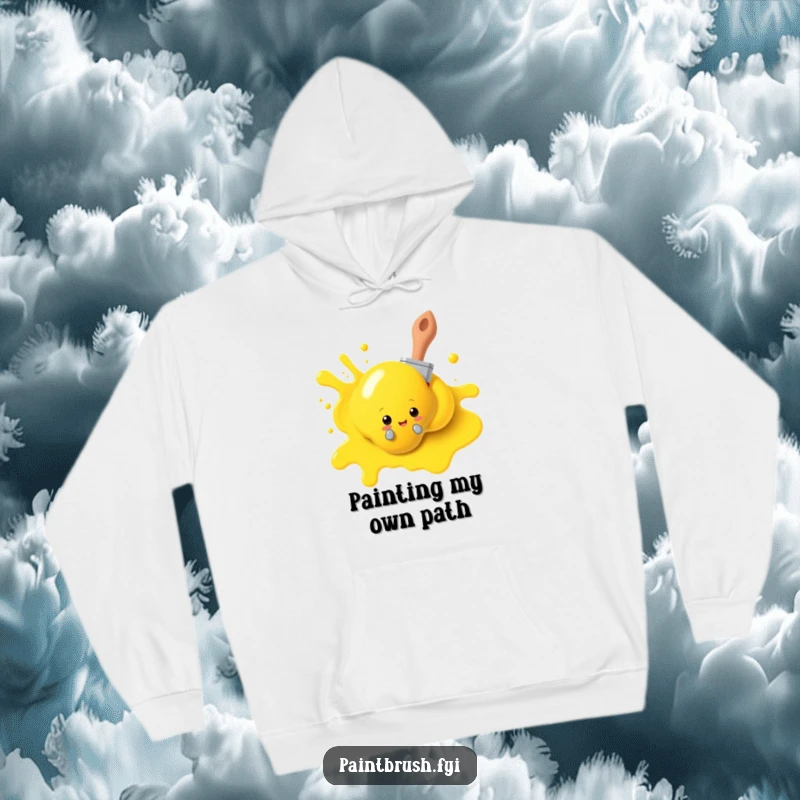 Funny paintbrush hoodie, playfully peeking from behind a large yellow paint blob, offering warmth and artistic humor. A perfect cozy gift.