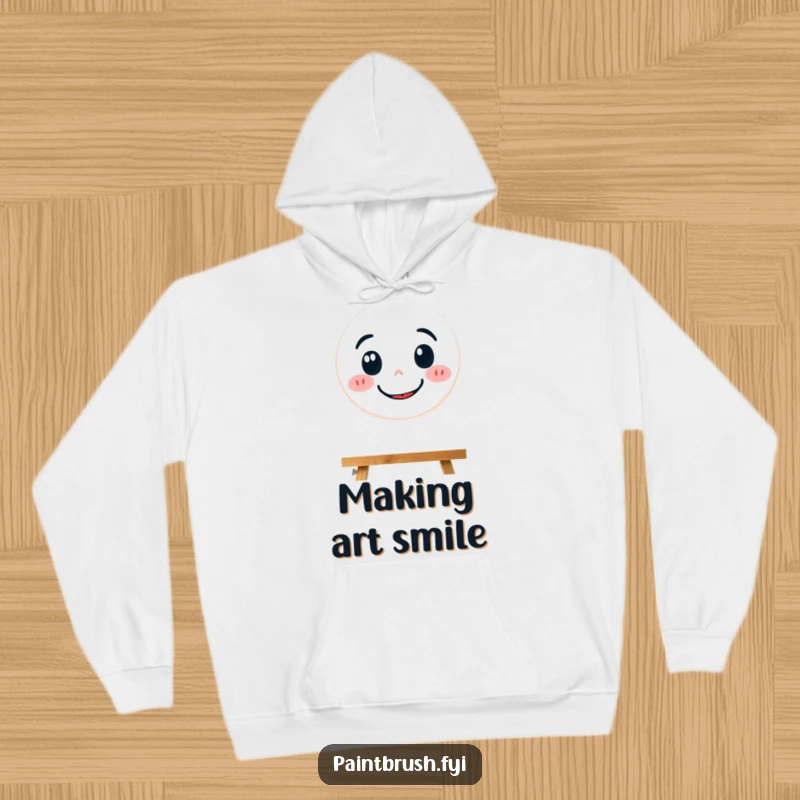 Funny hoodie illustration of a focused paintbrush character diligently painting a large, beaming smiley face.