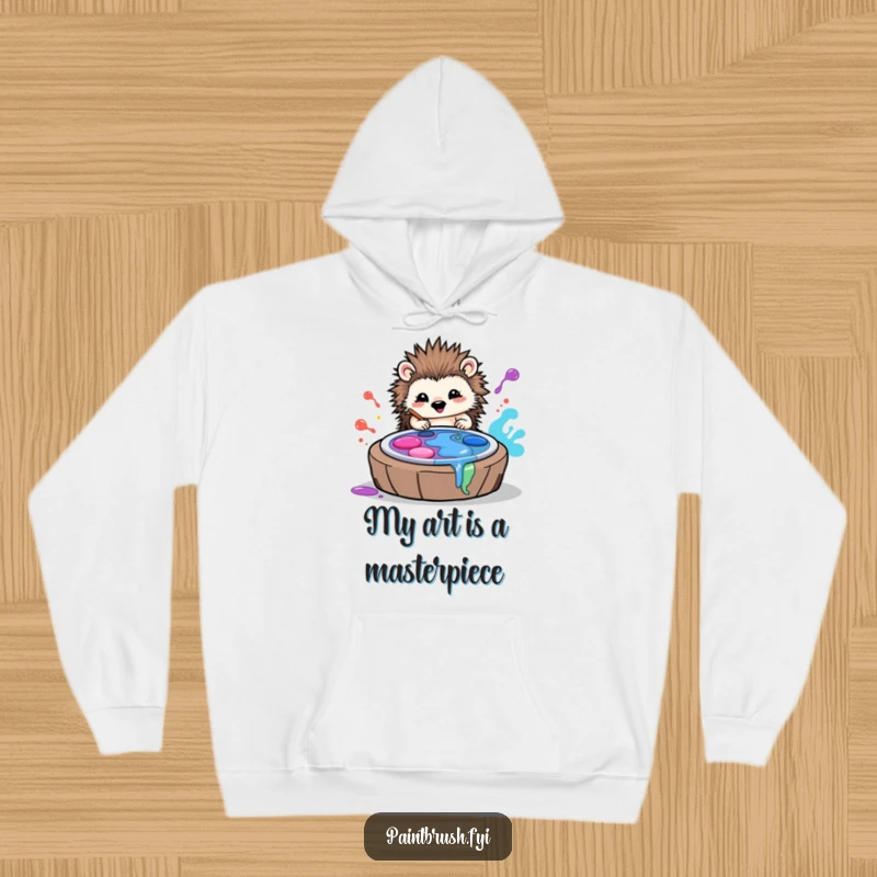 Funny hoodie featuring a delighted hedgehog artist creating colorful masterpieces by rolling through vibrant paint palettes.